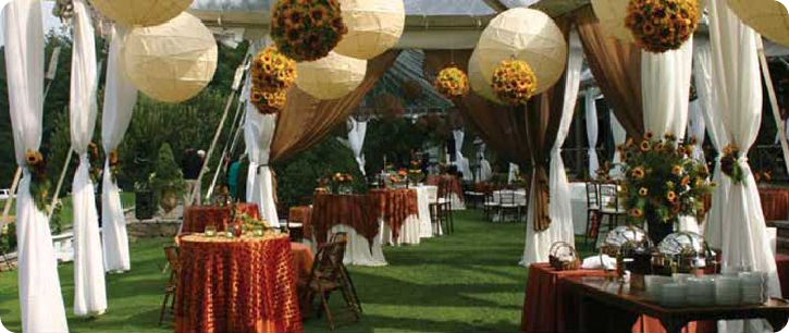 chinese lanterns with sunflower pomanders outdoor wedding reception