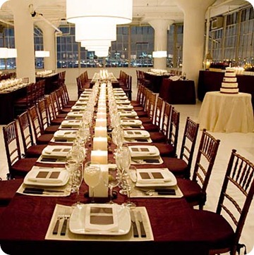 Long banquet tables have an impact with square pillars going down the center
