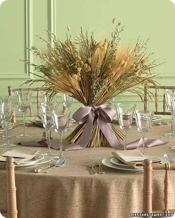 Bountiful dried grains and grasses tied with a large satin bow; 