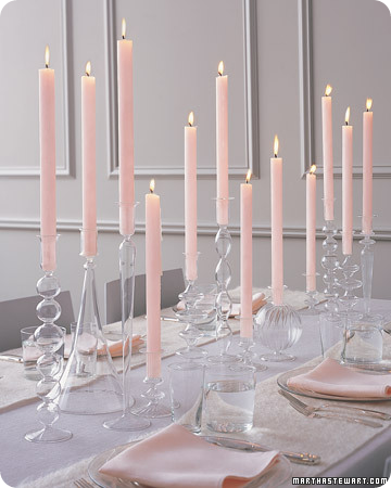 Soft color tapers in a mix of glass crystal candle holders of varying styles from Martha Stewart